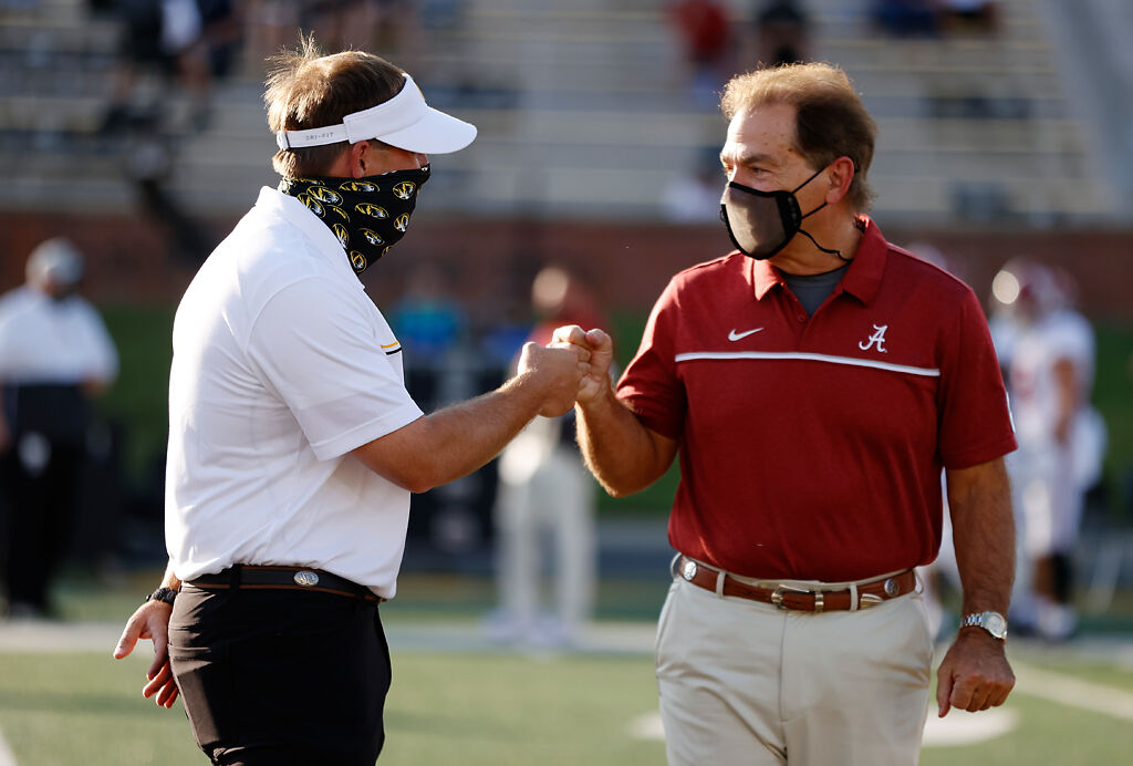 Drinkwitz and Saban fist bump